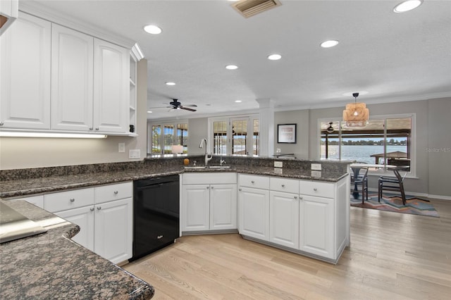 kitchen with ceiling fan, sink, black dishwasher, kitchen peninsula, and white cabinets