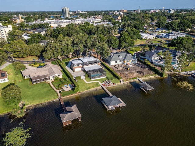 birds eye view of property with a water view