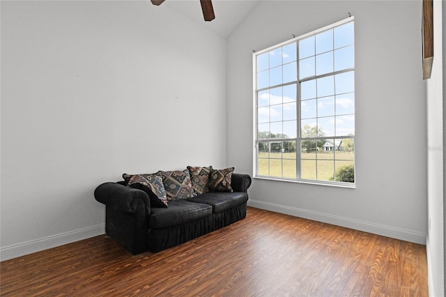 living room featuring ceiling fan, wood-type flooring, and high vaulted ceiling