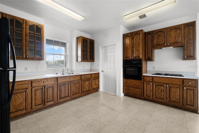 kitchen featuring sink and black appliances