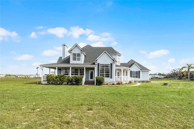 view of front of house featuring a front yard and covered porch