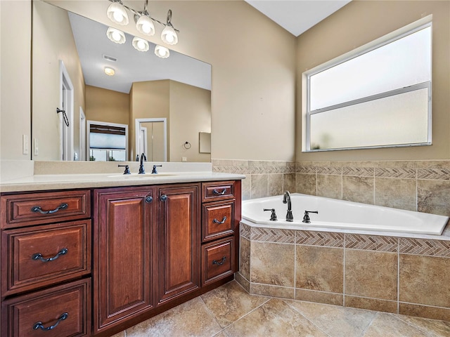 full bath with a bath, visible vents, and vanity