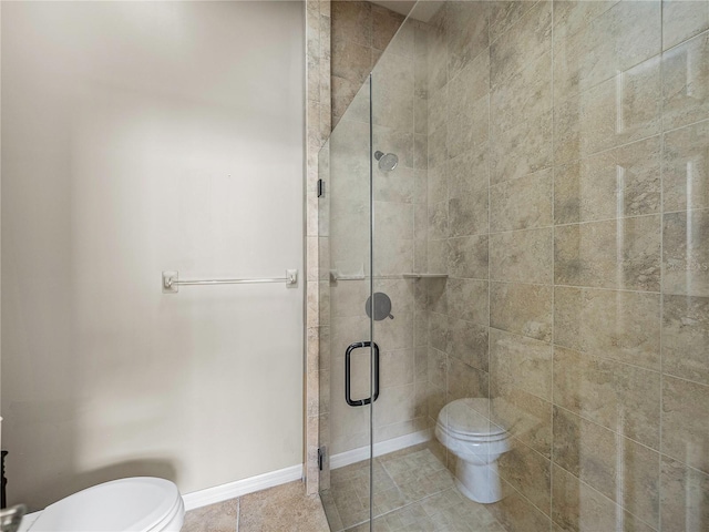 full bathroom with baseboards, a shower stall, toilet, and tile patterned floors