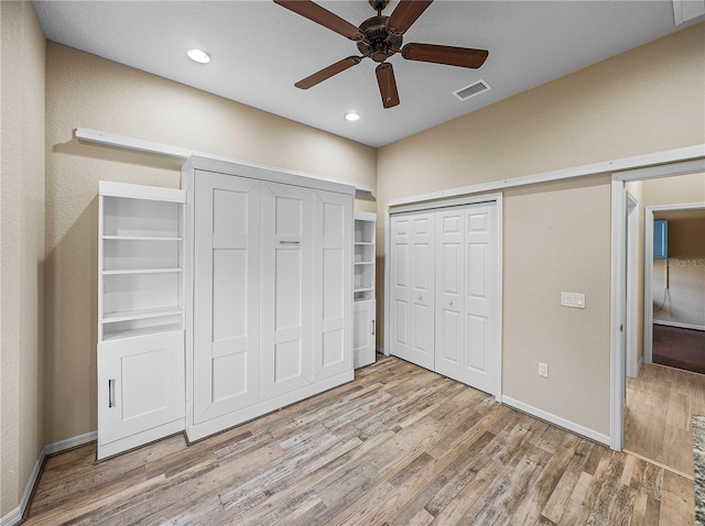 unfurnished bedroom featuring ceiling fan, recessed lighting, visible vents, baseboards, and light wood-style floors