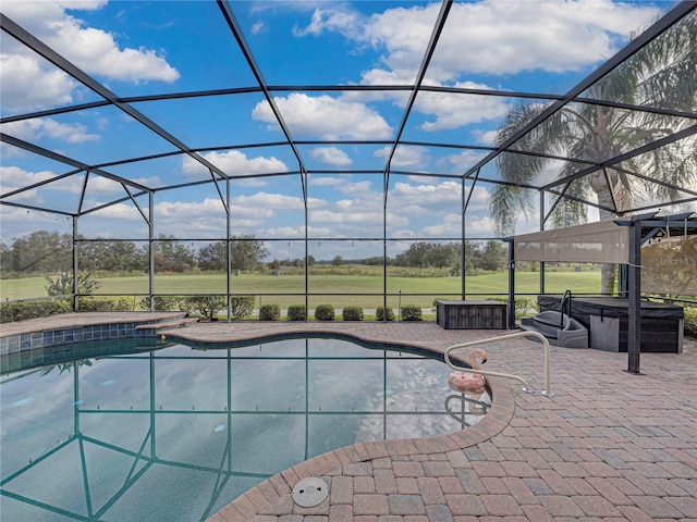 pool with a lanai and a patio area