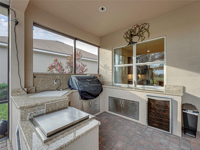 sunroom / solarium featuring wine cooler