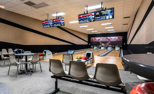 game room featuring bowling and a paneled ceiling