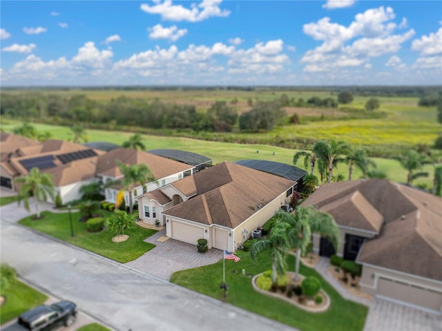 birds eye view of property with a residential view