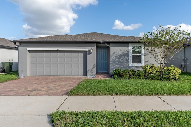 view of front of house with a front lawn and a garage