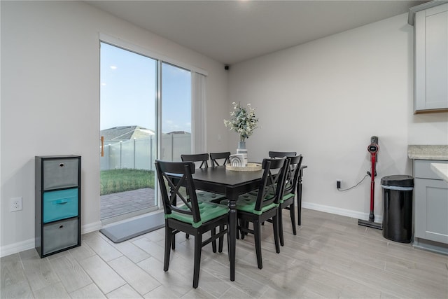 dining space featuring light hardwood / wood-style flooring