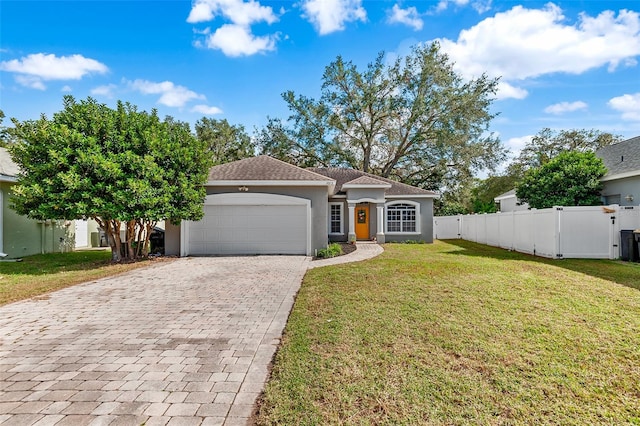 view of front of house with a front lawn and a garage