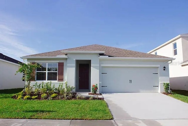 535 Noble Ave, Davenport, FL 33837 - view of front facade featuring driveway, an attached garage, a front yard, stucco siding, and roof with shingles