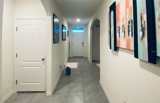 hallway featuring tile patterned floors