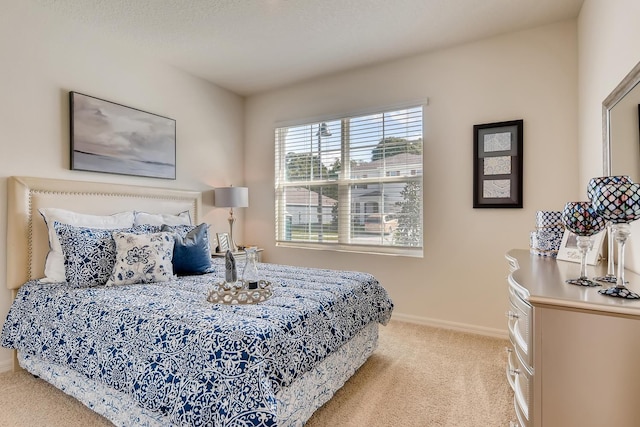 bedroom featuring light colored carpet