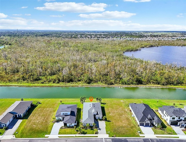 birds eye view of property featuring a water view