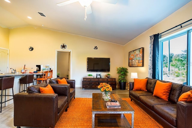 living room with vaulted ceiling and ceiling fan