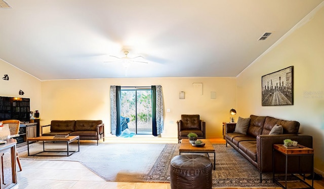 tiled living room with ceiling fan and lofted ceiling