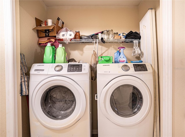 laundry room with independent washer and dryer