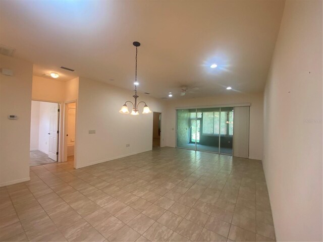 empty room featuring an inviting chandelier