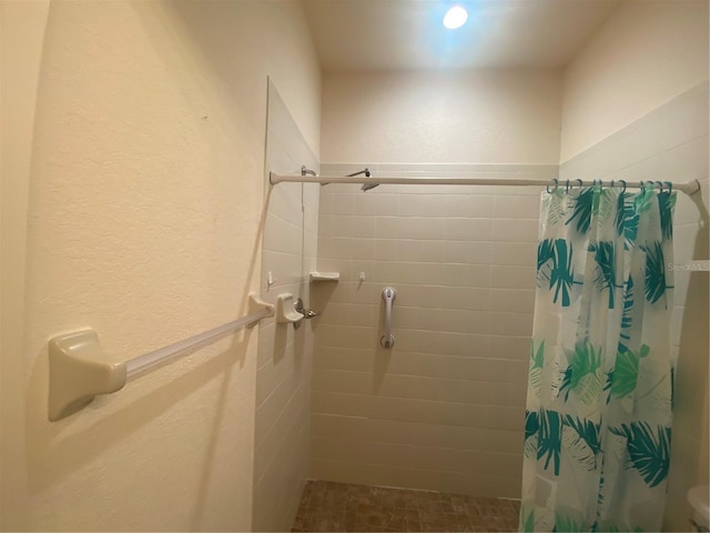 bathroom featuring walk in shower