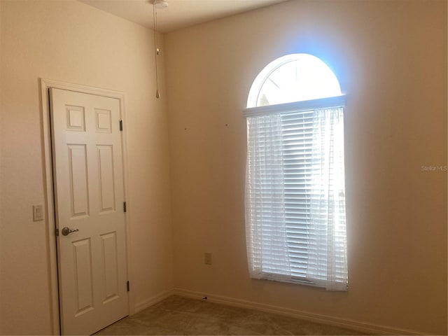 view of tiled spare room