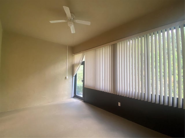 carpeted empty room with ceiling fan