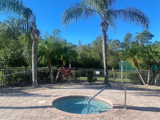 view of swimming pool featuring a community hot tub