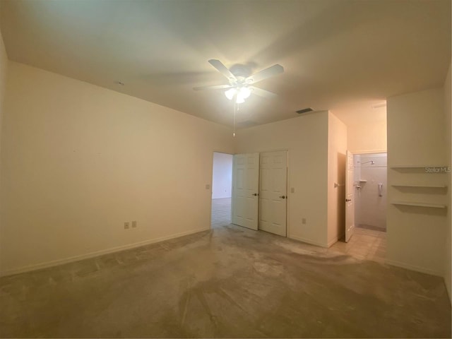 unfurnished bedroom with ceiling fan and light colored carpet