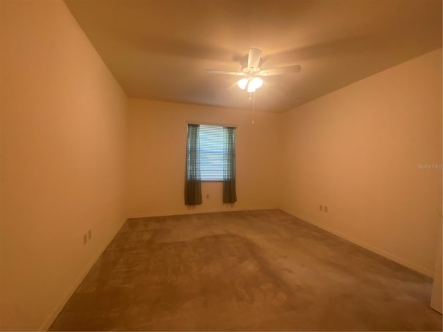 empty room with carpet flooring and ceiling fan