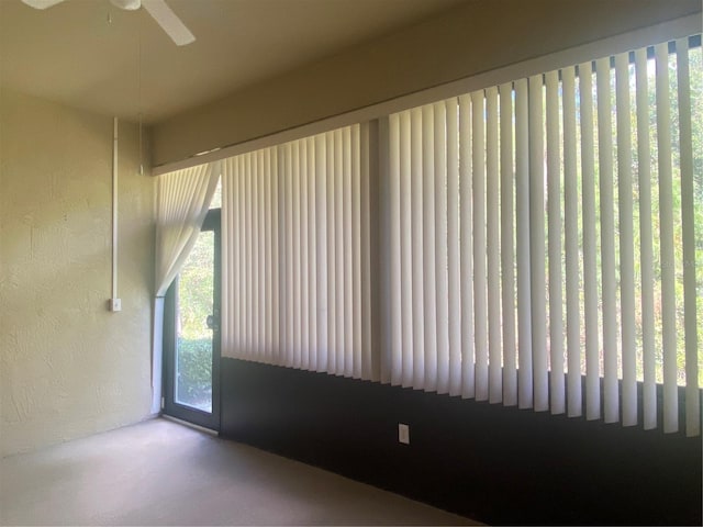 empty room featuring ceiling fan