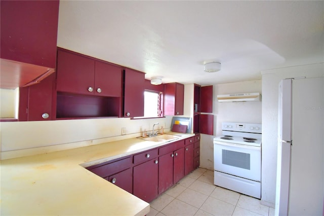 kitchen with light tile patterned flooring, white appliances, extractor fan, and sink