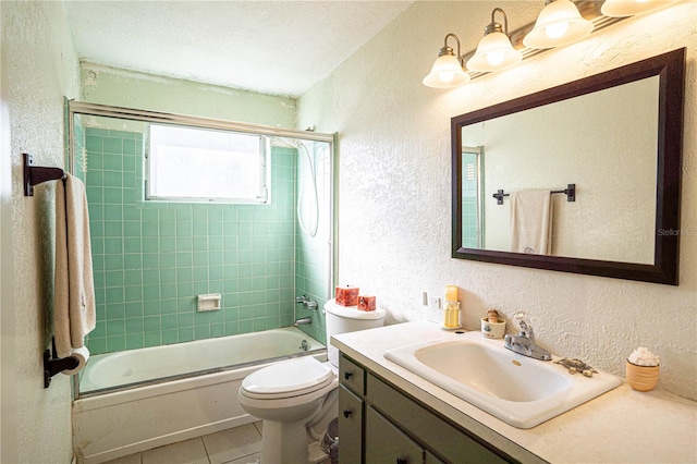 full bathroom with vanity, tile patterned floors, toilet, enclosed tub / shower combo, and a textured ceiling