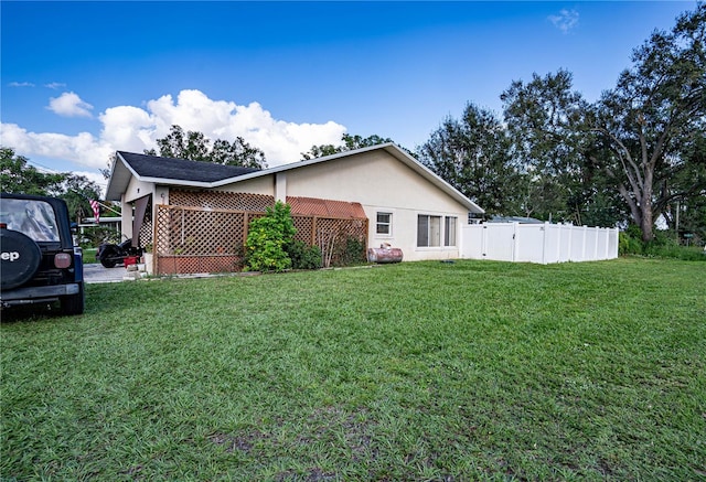 view of property exterior featuring a yard