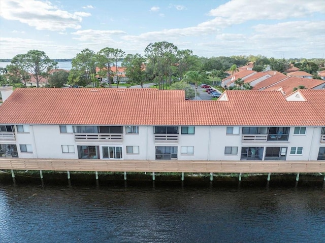 birds eye view of property featuring a water view