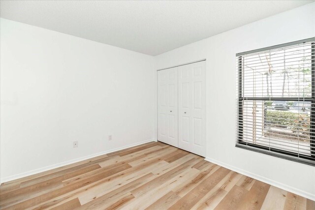 unfurnished bedroom with light hardwood / wood-style floors