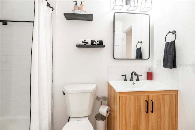 bathroom with vanity and toilet