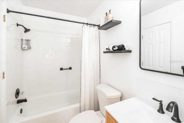 full bathroom with shower / bath combo, vanity, and toilet