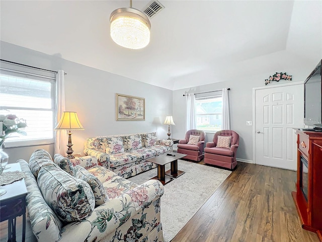 living room with dark hardwood / wood-style floors