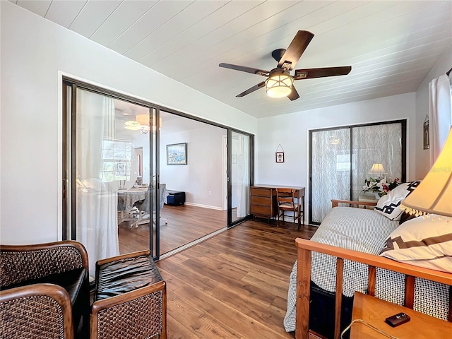 bedroom featuring dark hardwood / wood-style flooring, a closet, and ceiling fan