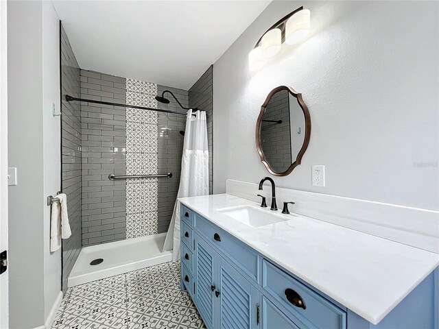 bathroom with vanity and a shower with shower curtain