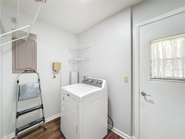 washroom with dark hardwood / wood-style floors, electric panel, and washer / clothes dryer