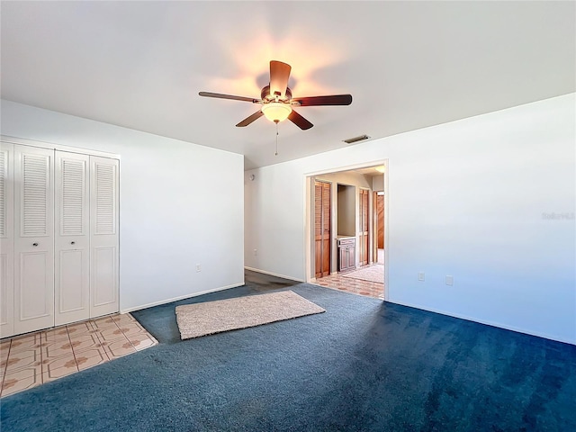 221 Dorothy St, Auburndale, FL 33823 - unfurnished bedroom featuring carpet floors, a ceiling fan, and a closet