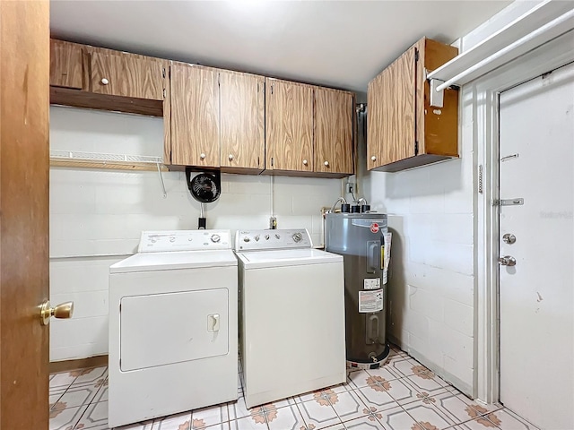 laundry area with cabinets, separate washer and dryer, and water heater