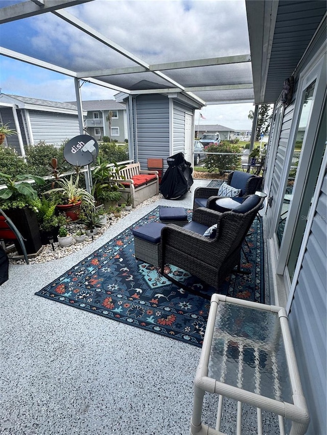 view of patio / terrace with glass enclosure