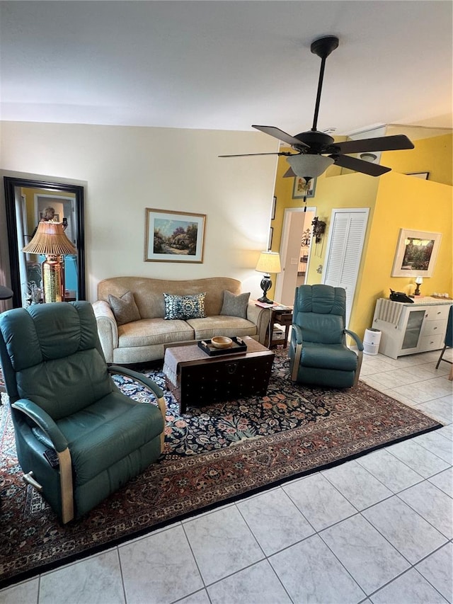 tiled living room with vaulted ceiling and ceiling fan