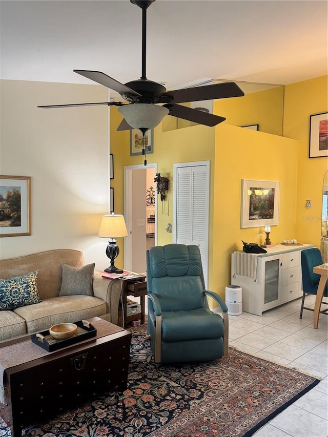 tiled living room featuring ceiling fan