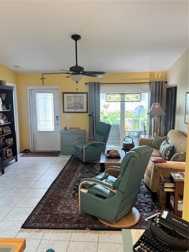 living room featuring ceiling fan and light tile patterned flooring