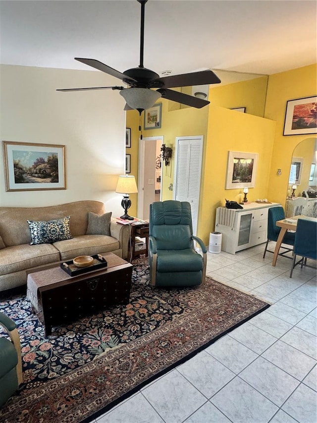 tiled living room with ceiling fan