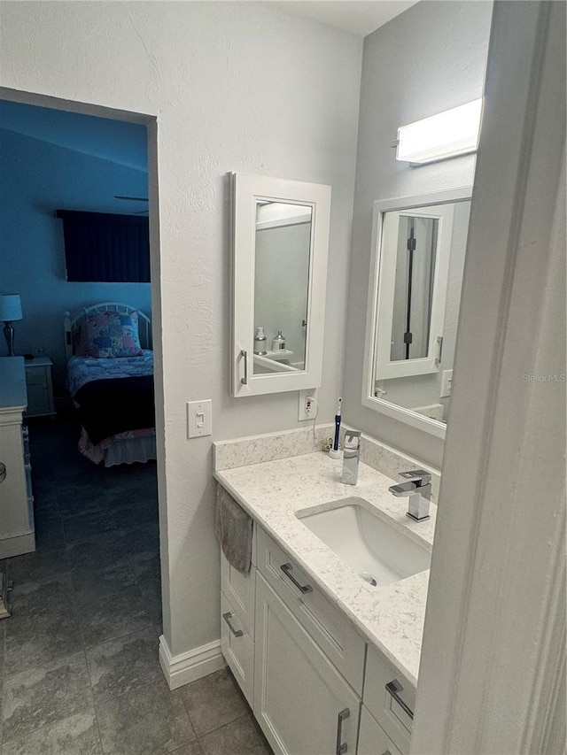 bathroom with vanity and tile patterned floors