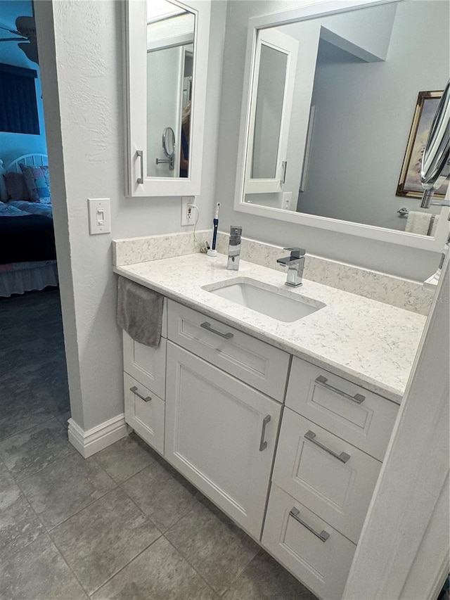 bathroom featuring tile patterned flooring and vanity